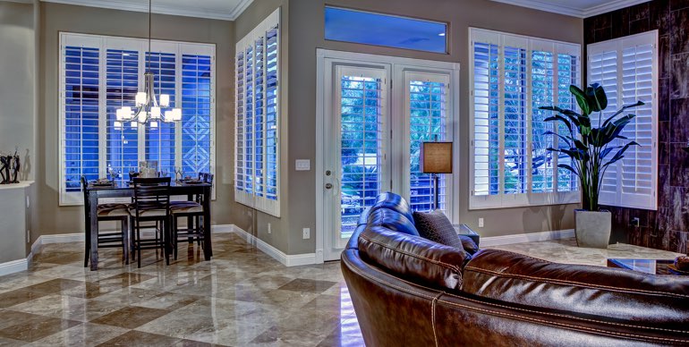 Cleveland great room with plantation shutters and modern lighting.